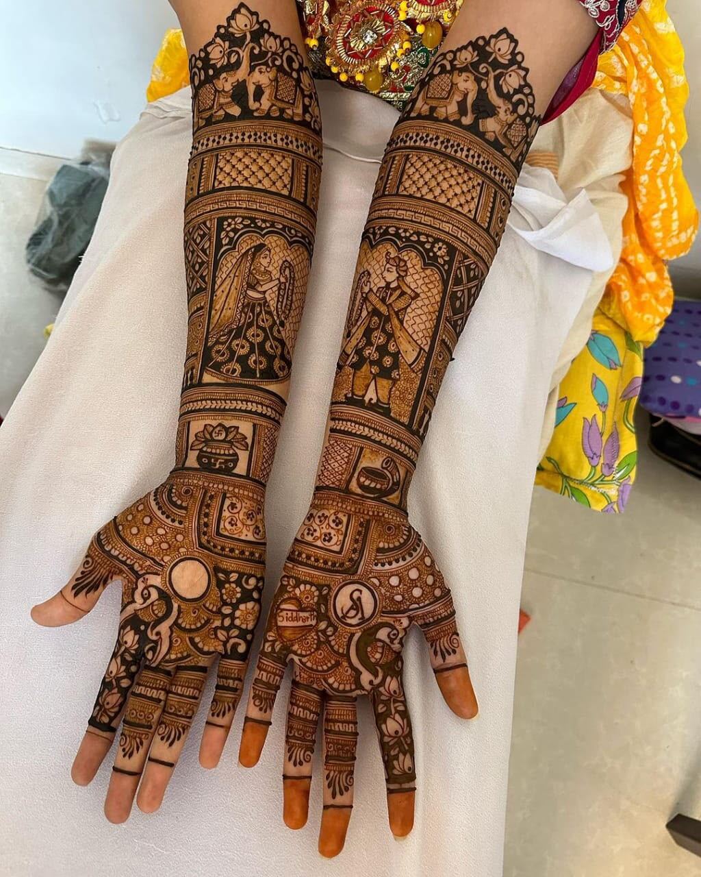Bridal mehndi couple forearm design