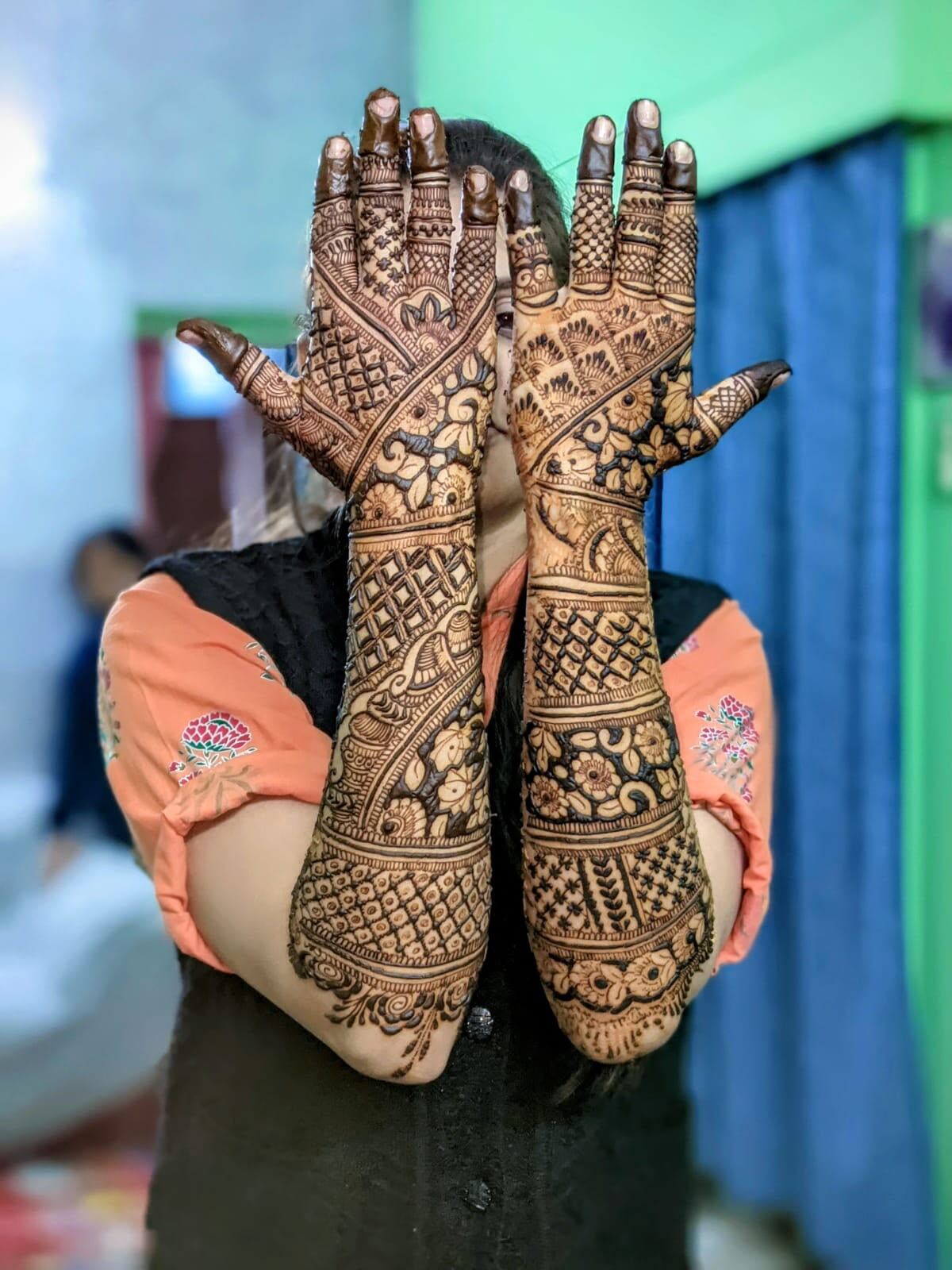 Arabic floral mehndi crossed hands design